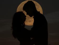 silhouette of Couple in Love at full moon, drawing