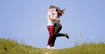 couple in love hugging in the meadow