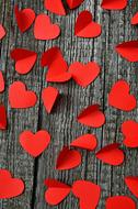 Beautiful, red heart signs, on the wooden surface