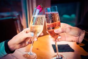 Celebration, glasses with Champagne in male and female hands