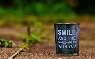 the inscription on the bucket smile and the world will smile with itself