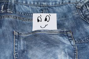 drawn emoticon in jeans pocket