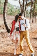 couple in love with camera in the park