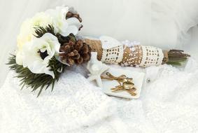 white Flowers and wedding Rings