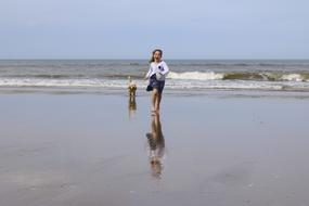 Young Girl Child walking on beach