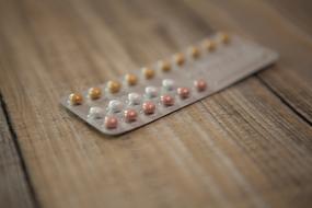 photo of multi-colored small tablets in a blister