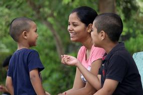 mom laughs with sons