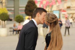 young caucasian Couple in Love Kissing in city