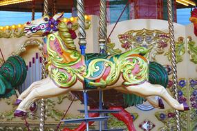 Colorful and beautiful, patterned horse on the carousel, on the festival