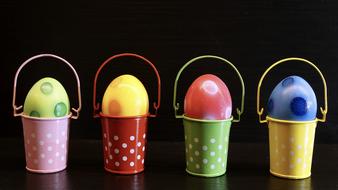 colorful Easter eggs in stand buckets