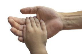 Hands of Adult man And Child boy together, Family