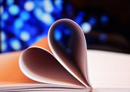 Heart folded Book pages at Blue lights