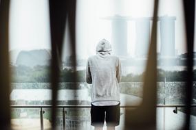 man in sweatshirt on the terrace