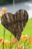 wooden heart and meadow flowers