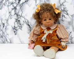 Doll Girl Sad grey wall