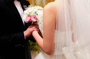 beautiful newlyweds with a bouquet close up