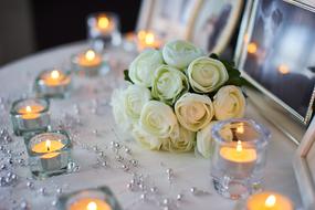 burning candles around Wedding bouquet