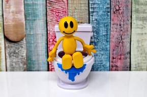 Toilet Smiley Figure yellow