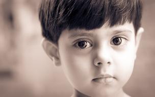 monochrome portrait of a boy on a blurred background