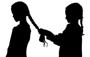 silhouettes of two child girls with braids, friendship,