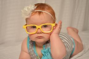 Cute Baby with yellow Glasses