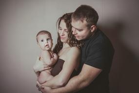 Family of man woman and kid