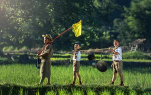 three happy asian child Boys Scouting