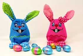 Cute, colorful and beautiful Easter bunnies and shiny Easter eggs