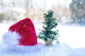 santa hat in the snow in a blurred background