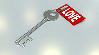 Shiny, metal key with red and white "Love" sign on the tag