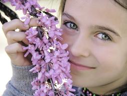 pretty Girl with pink flowers at face