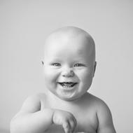 Black and white portrait of the cute, smiling baby