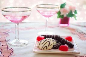 glasses with Pink Wine and dessert on table