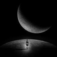 a lonely man walks the planet under the light of the moon