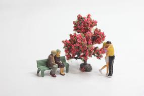 Couples Miniature Figures and tree red