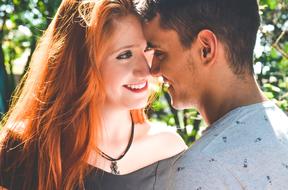 Profile portrait of the couple, kissing in love