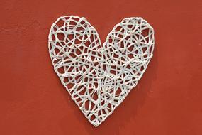 decoration in the form of a heart on a red background