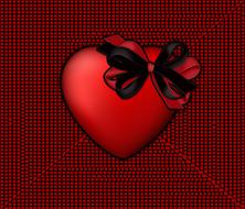 heart with black and red bow at textured background