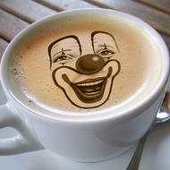clown face on cup of coffee