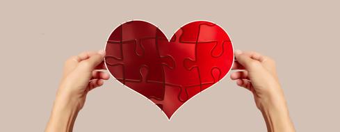 heart shape puzzle in male hands