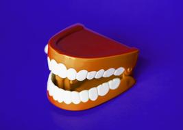 Artificial teeth at Blue Background, render