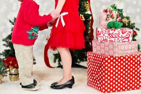 mom with child near Christmas gifts