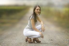 Nice Girl on a country road on a blurred background