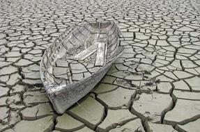 broken and abandoned boat in the swamp