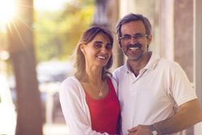 Happy, smiling couple, together, in sunlight