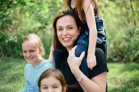 Portrait of the smiling family, among the green plants