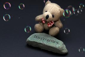 Mourning Stone and teddy bear toy