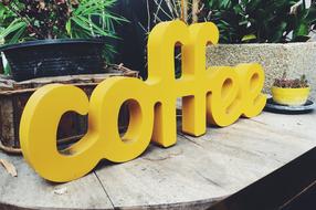 Coffee as a yellow letters in a cafe