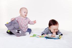 Cute children, playing with the colorful toys, together