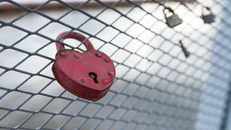 heart shaped padlock on the fence